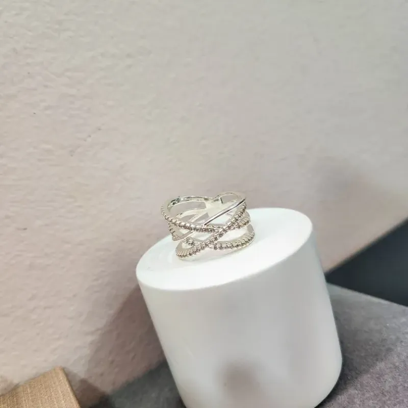 ANEL PRATA ENTRELAÇADO ZIRC
