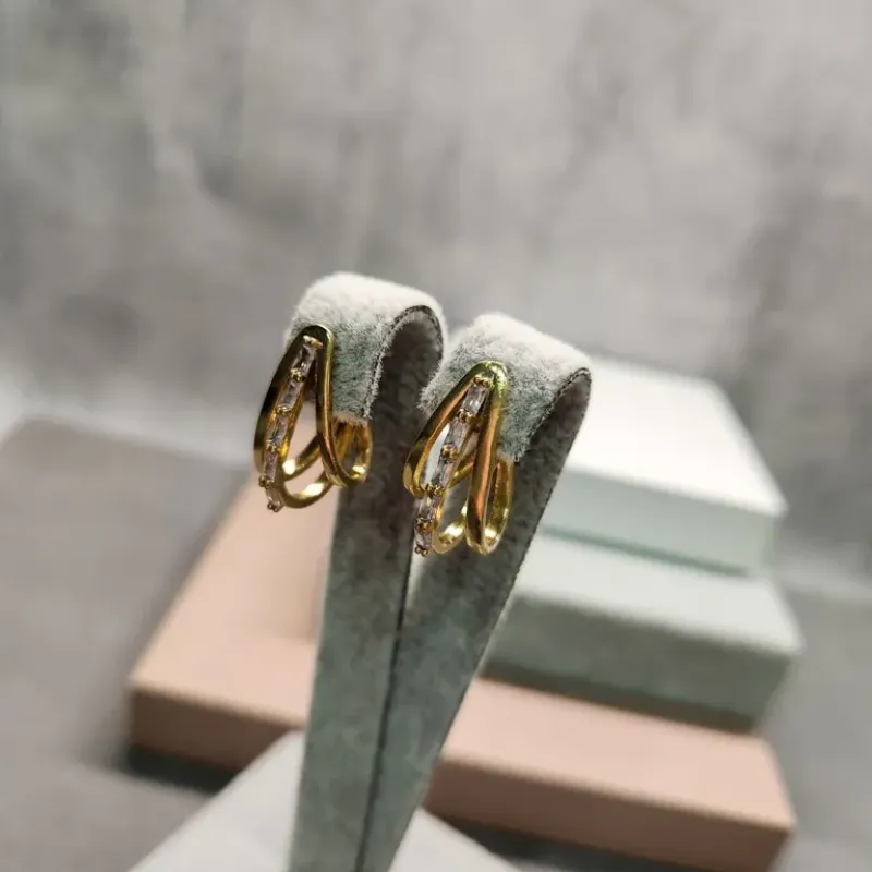 BRINCO OURO MEIA ARGOLA NAV LISA