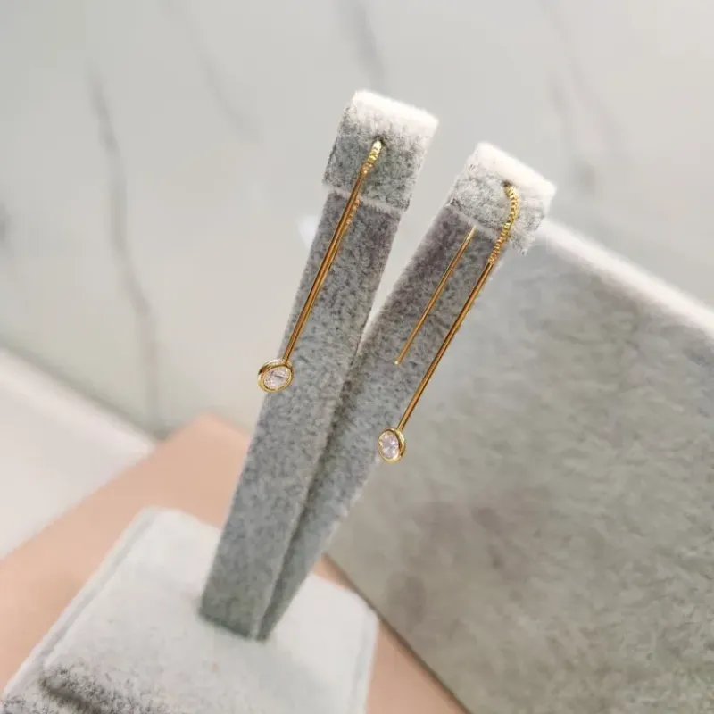 BRINCO OURO DOIS PALITOS