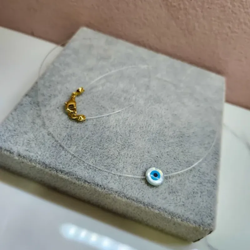 COLAR INVISÍVEL OLHO MADREP OURO