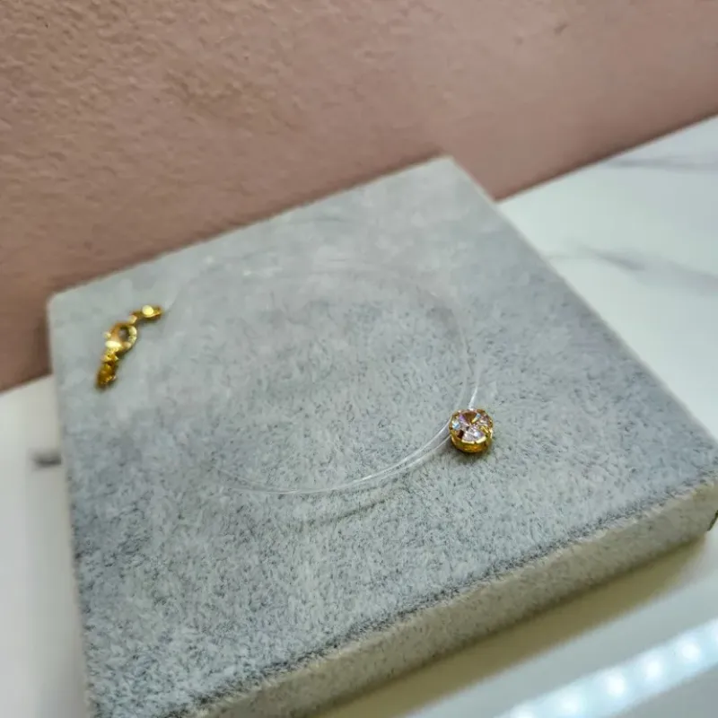 COLAR INVISÍVEL PONTO DE LUZ OURO