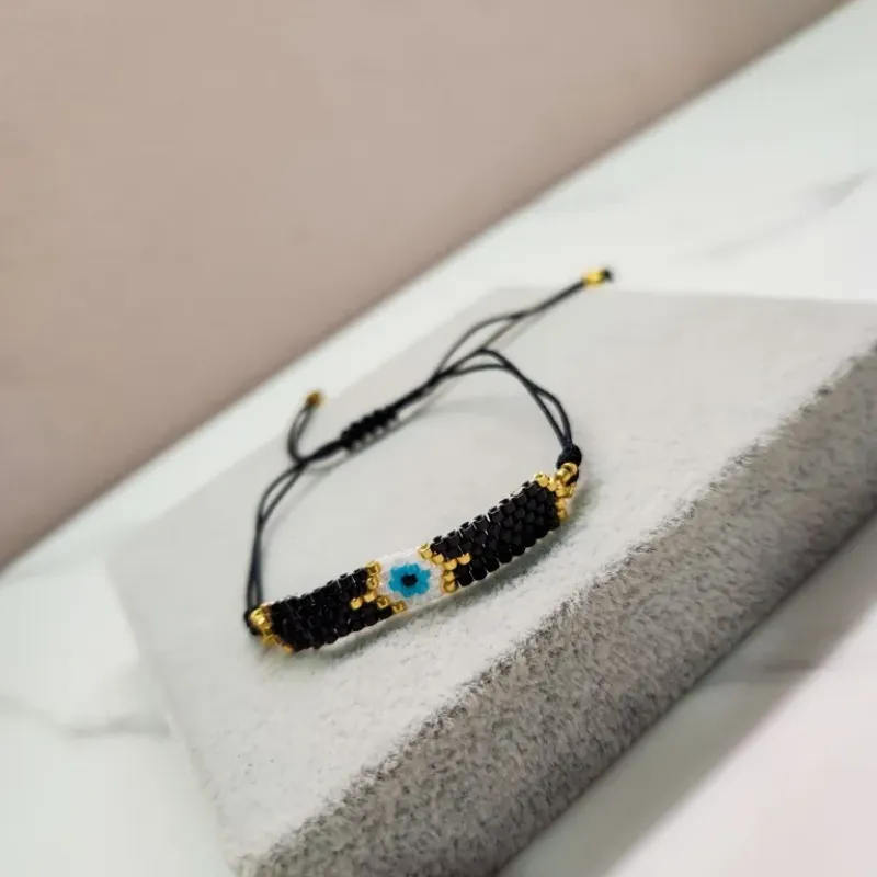 PULSEIRA OURO OLHO PRETO