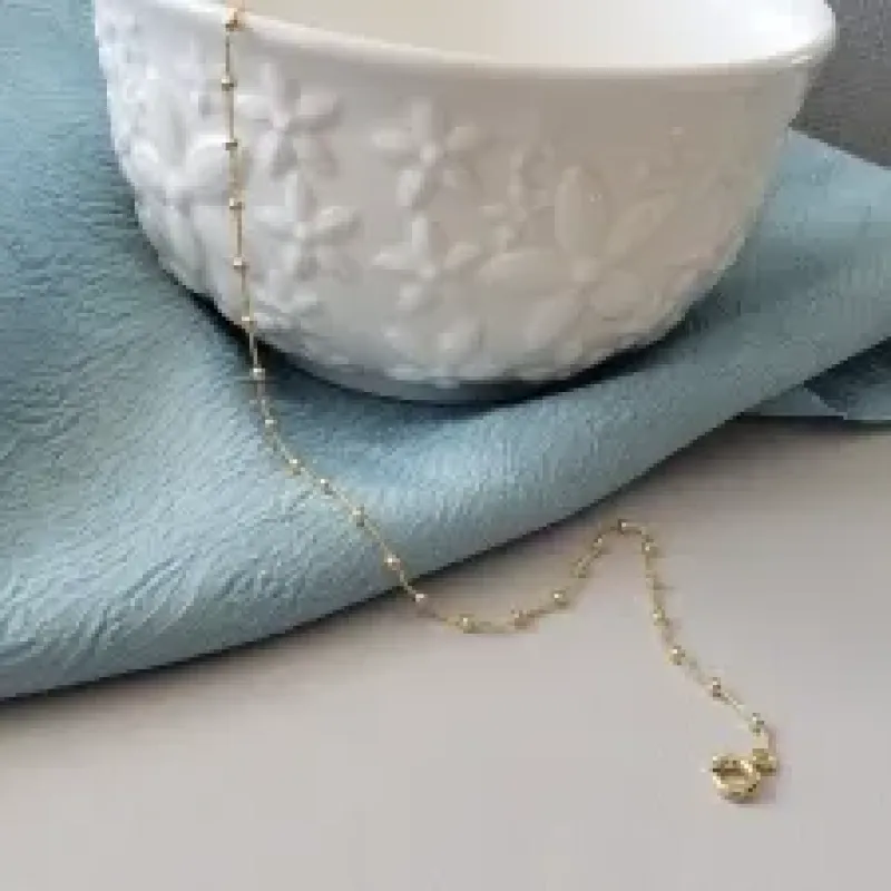 TORNOZELEIRA OURO BOLINHAS MINI