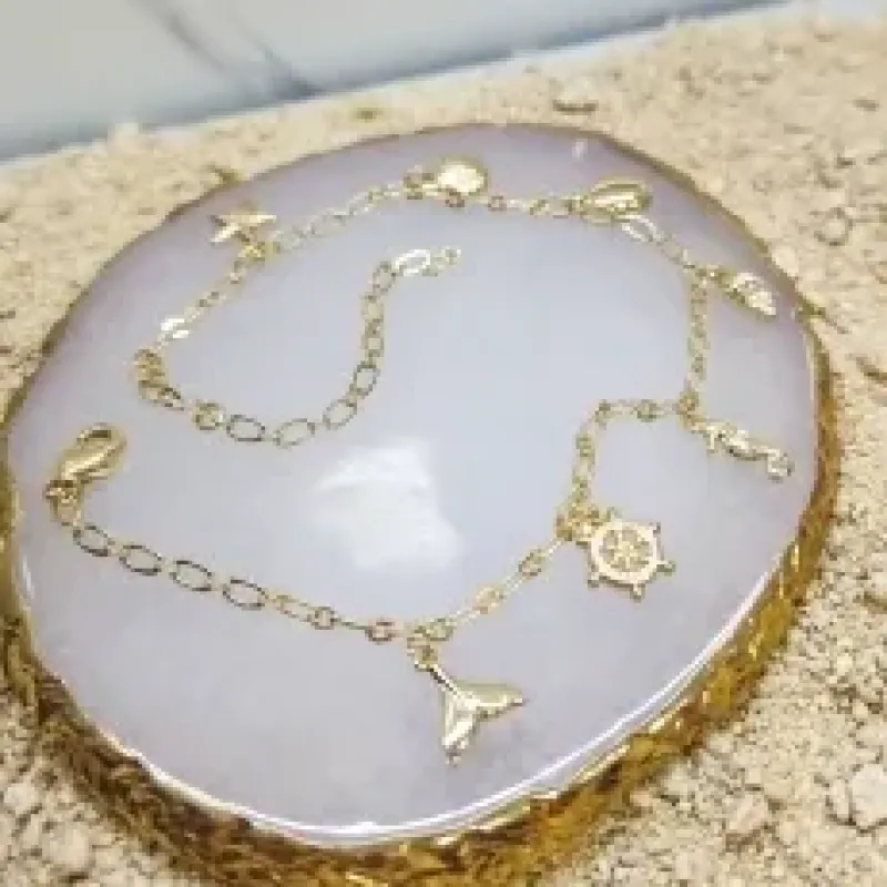 TORNOZELERIA OURO  FUNDO DO MAR