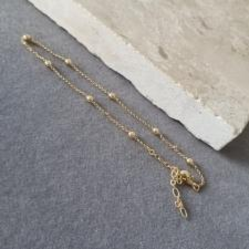 TORNOZELEIRA OURO BOLAS	