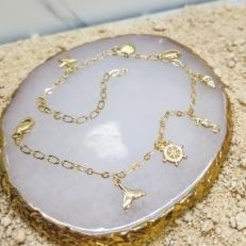 TORNOZELERIA OURO  FUNDO DO MAR