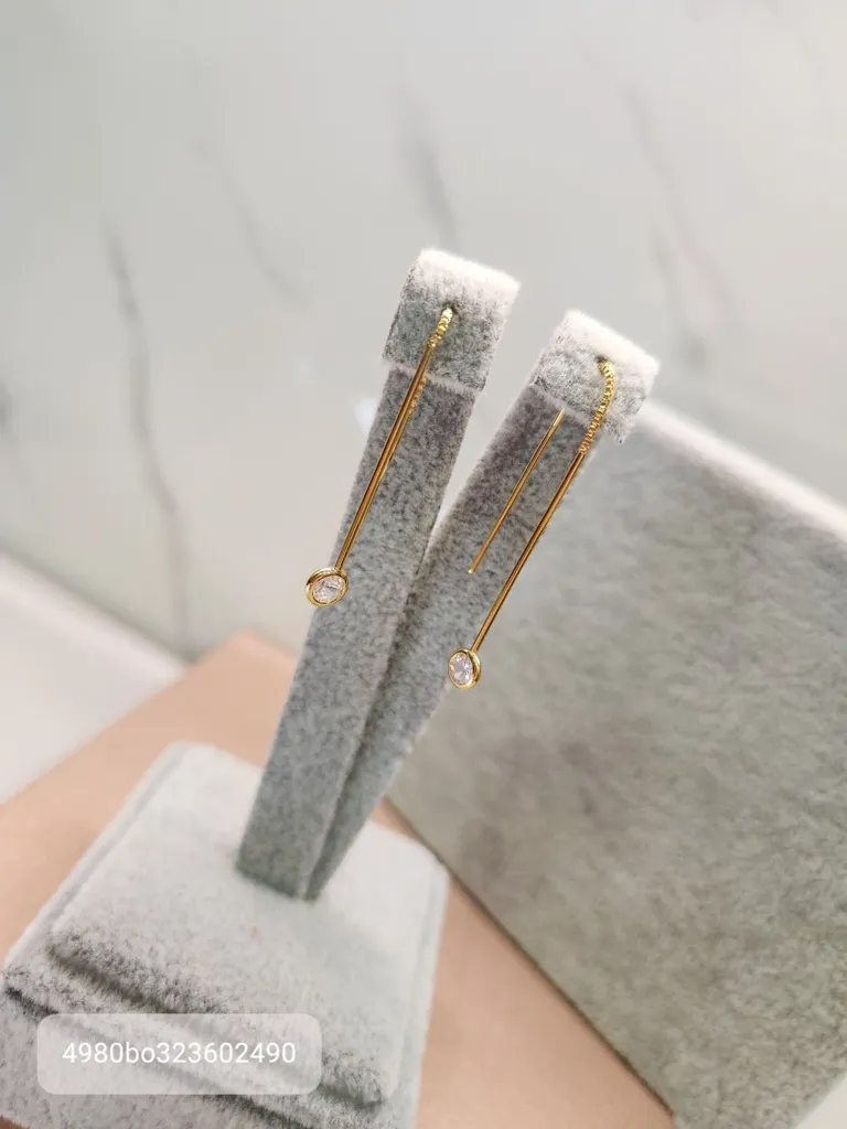 BRINCO OURO DOIS PALITOS