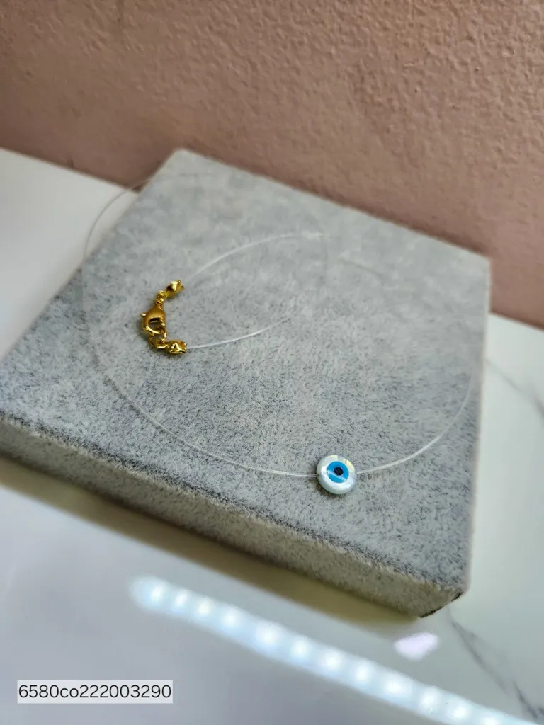 COLAR INVISÍVEL OLHO MADREP OURO