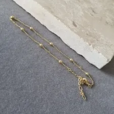 TORNOZELEIRA OURO BOLAS	